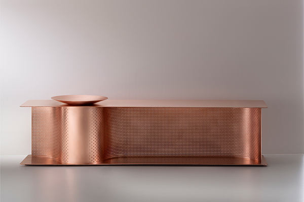 A copper shoe bench with sinuous sense of movement