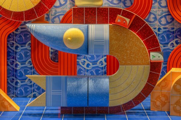Hand-drawn tiles break free from their grid, transforming into living landscapes where Hermès objects become the heart of the tale.